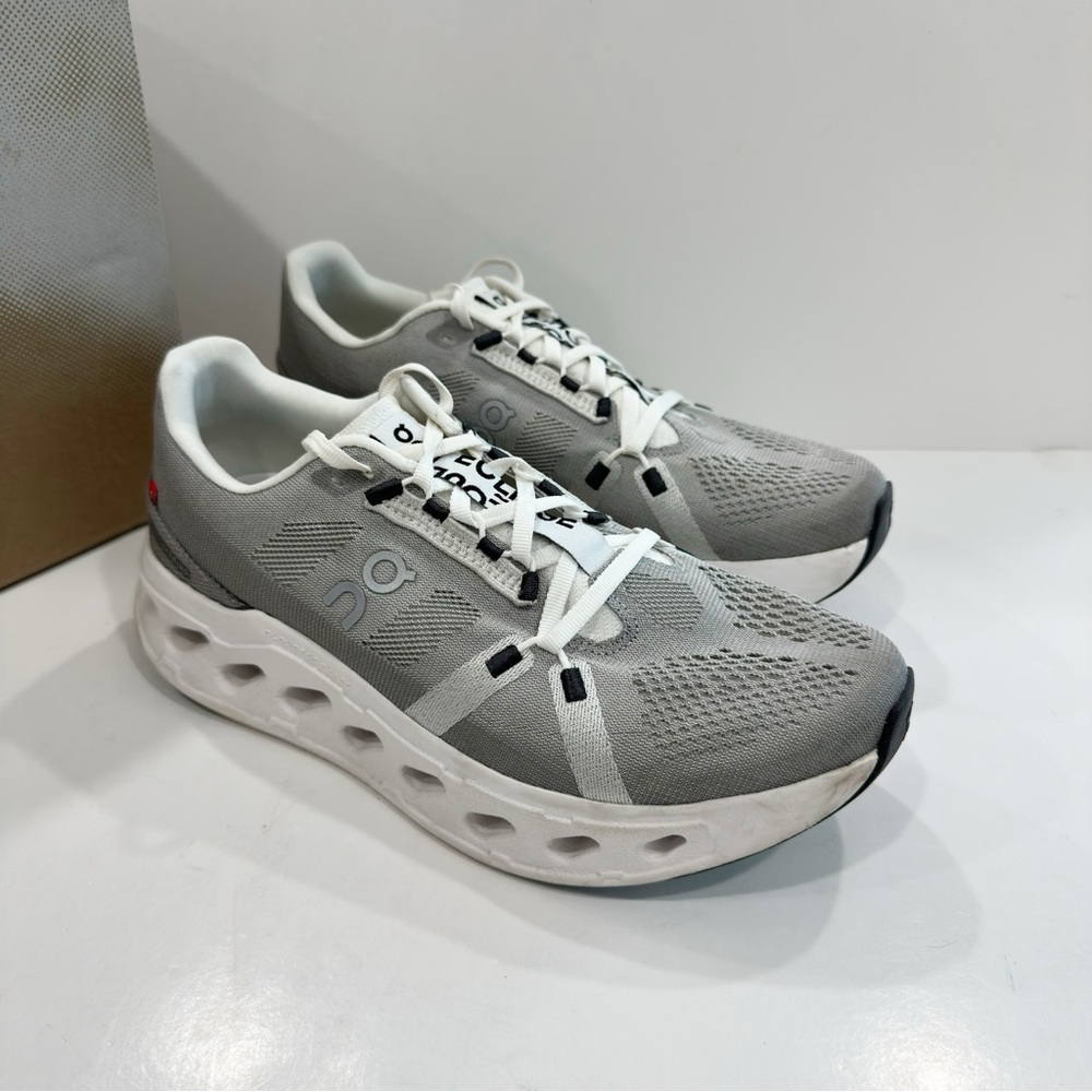 On Running Gray and White Athletic Shoes